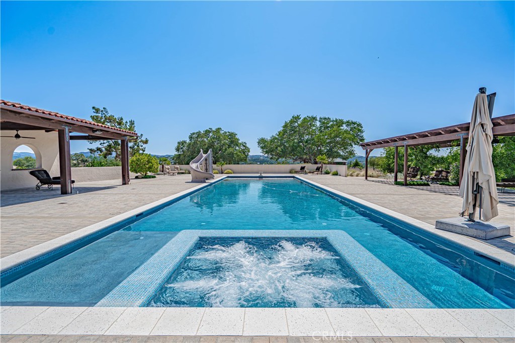 3030 Templeton Road Templeton, CA 93465 - Photo 6 of 75 Enjoy the best of both worlds with a spa built directly into the pool — perfect for unwinding after a swim.