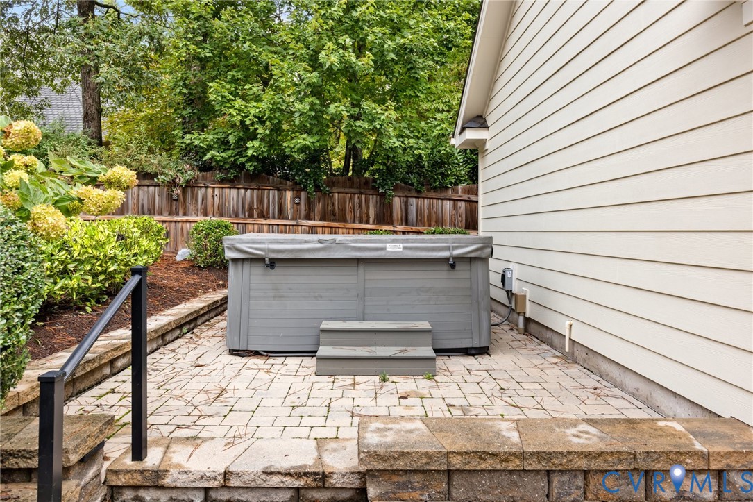 119 Countryside Lane Henrico, VA 23229 - Photo 72 of 76 a view of a patio with table and chairs with wooden fence and plants