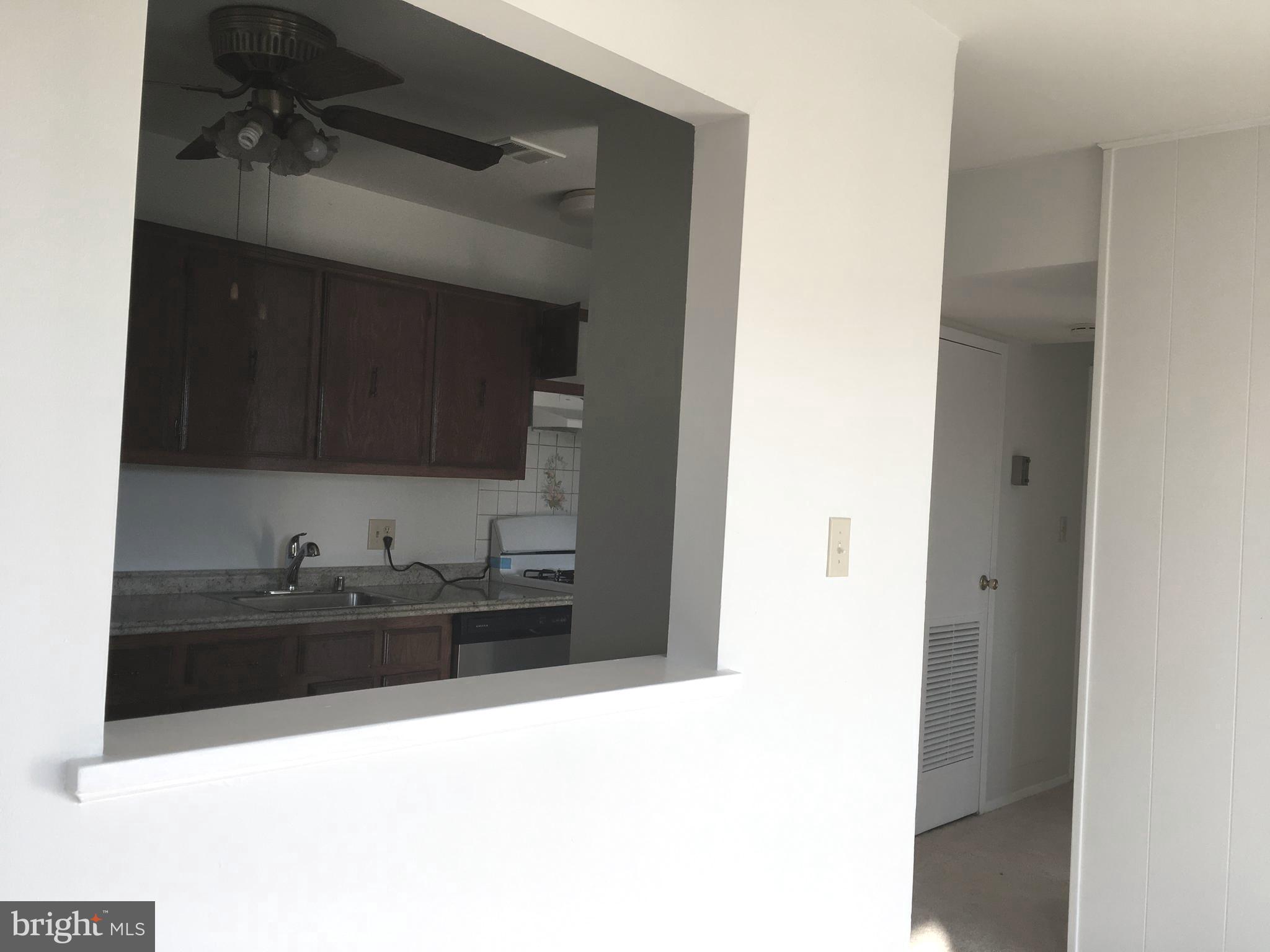 3802 Bel Pre Road, Unit 1327 Silver Spring, MD 20906 - Photo 7 of 26 Kitchen opening to dining room