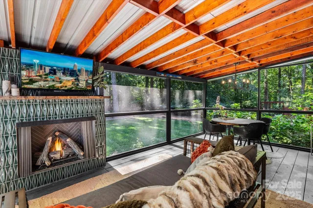a view of a patio with a table chairs and a fireplace