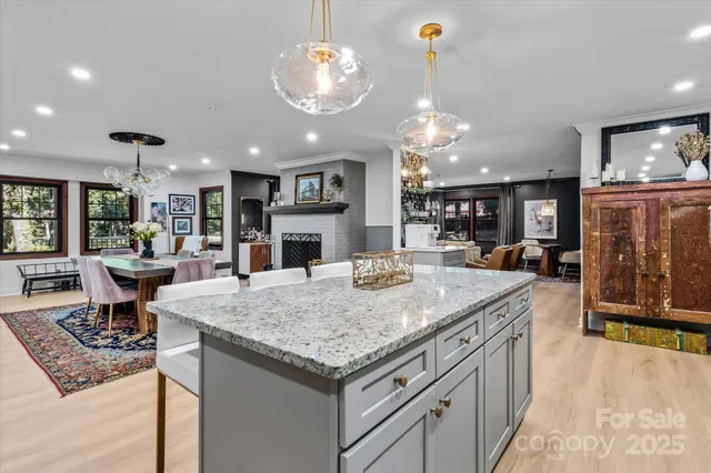 a view of kitchen island kitchen island dining table and chairs