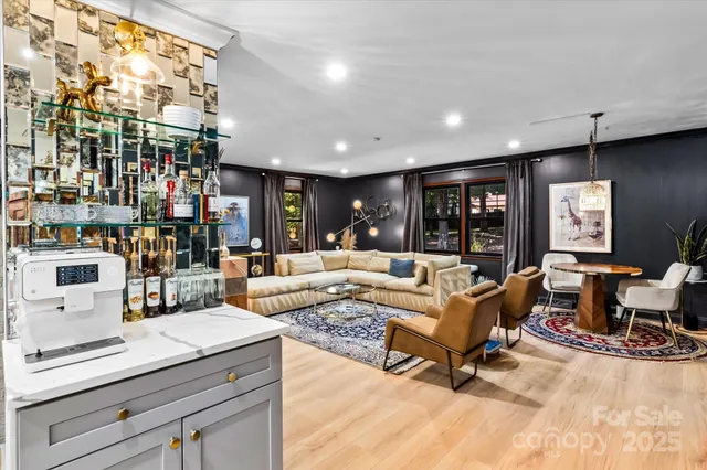 a living room with furniture and a table