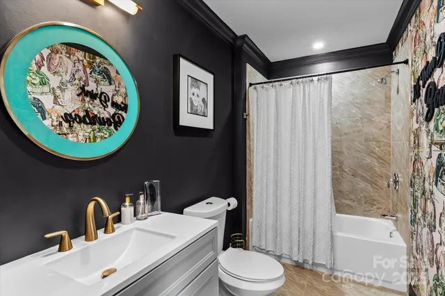 a bathroom with a sink a toilet and a bathtub