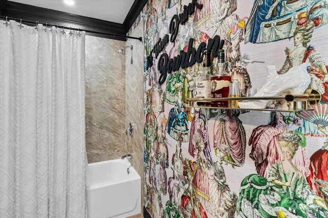 a view of walk in closet with clothes