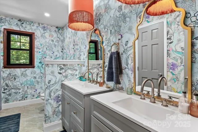 a bathroom with a sink a vanity and a mirror