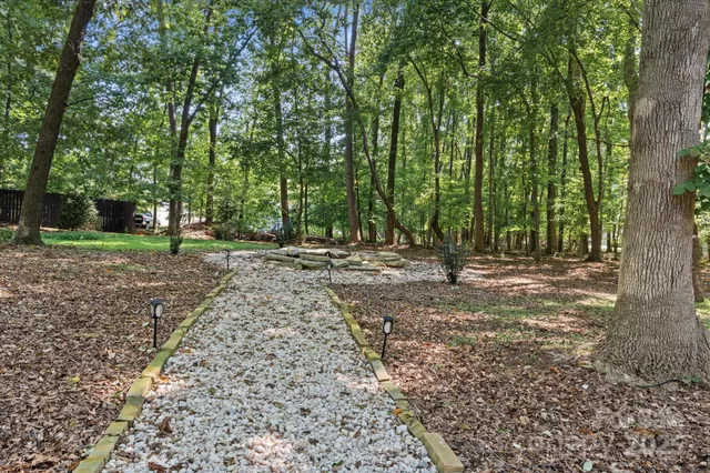 a view of outdoor space with deck and yard