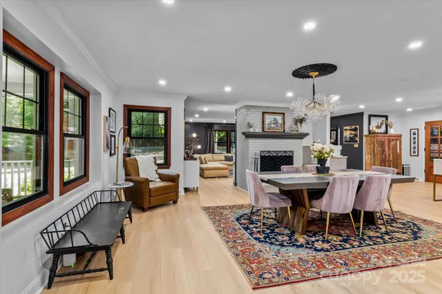 a living room with furniture a table and a fireplace