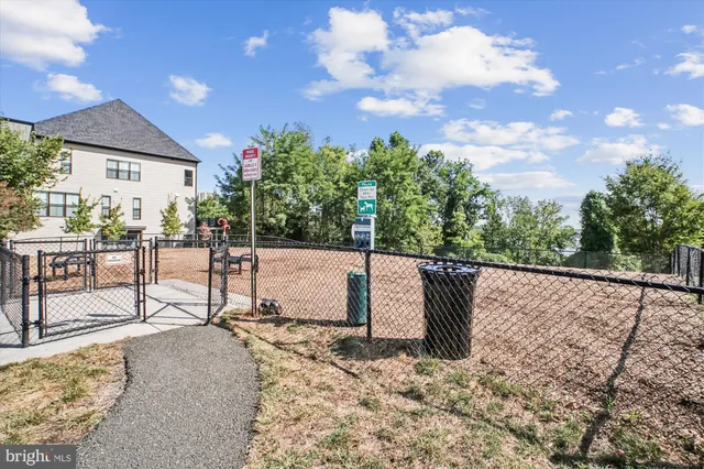 a view of a backyard with sitting area