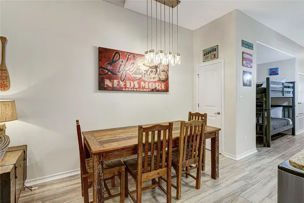 a view of a dining room with furniture and wooden floor