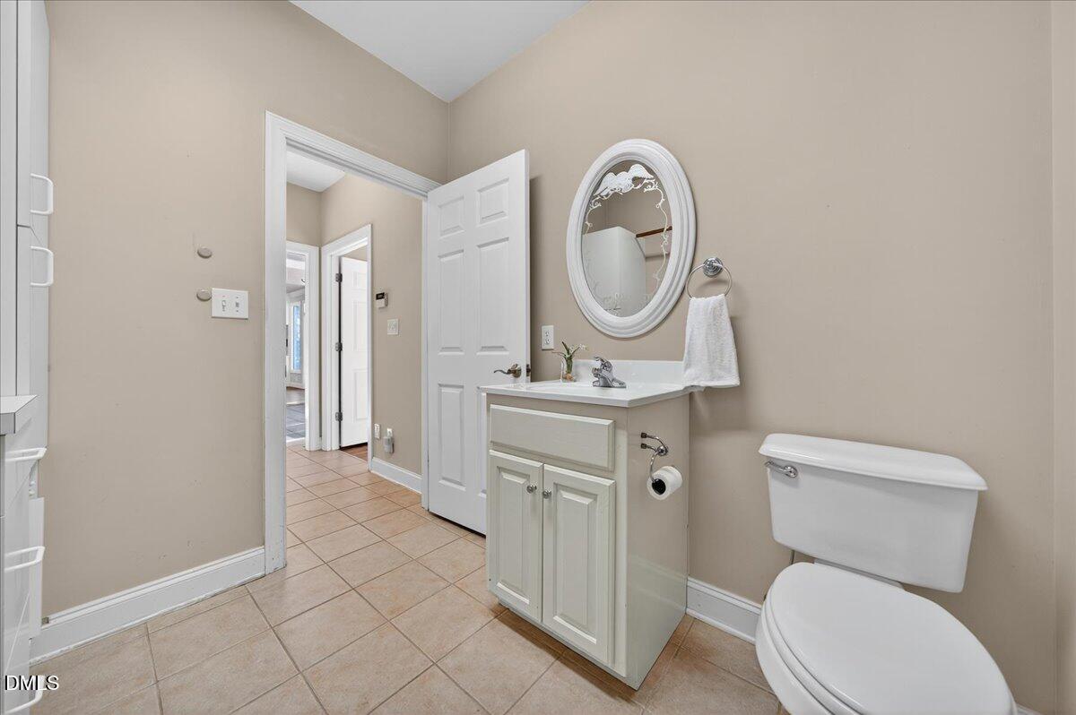 1409 St Patrick Drive Raleigh, NC 27603 - Photo 35 of 53 Main floor laundry and half bath