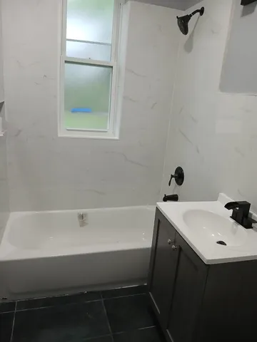 a bathroom with a sink and a bathtub