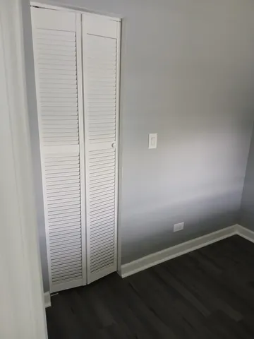 an empty room with wooden floor