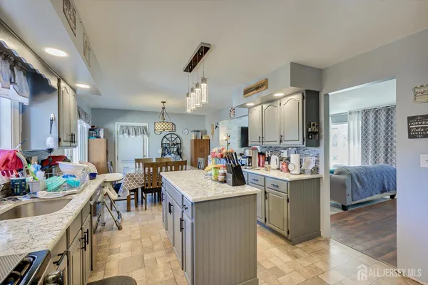 a bedroom with a bed and flat screen tv