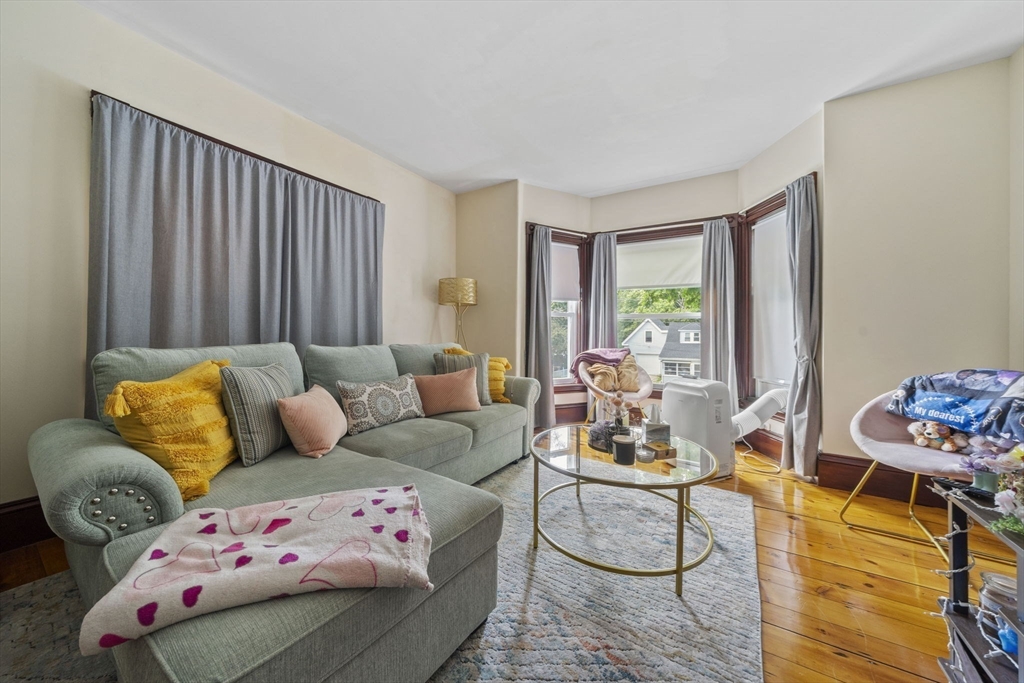 96 Plymouth Street, Unit 2 Abington, MA 02351 - Photo 4 of 9 a living room with furniture and a window