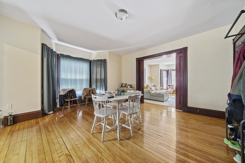 96 Plymouth Street, Unit 2 Abington, MA 02351 - Photo 5 of 9 a view of a dining room with furniture and wooden floor