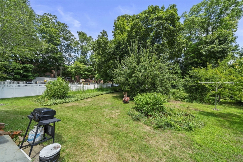 96 Plymouth Street, Unit 2 Abington, MA 02351 - Photo 9 of 9 a view of a chair and table in backyard of the house