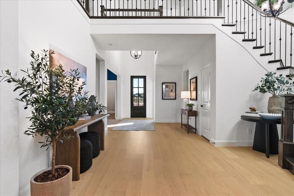 14550 Helena Street Pilot Point, TX 76258 - Photo 2 of 14 a view of an entryway with wooden floor and a livingroom
