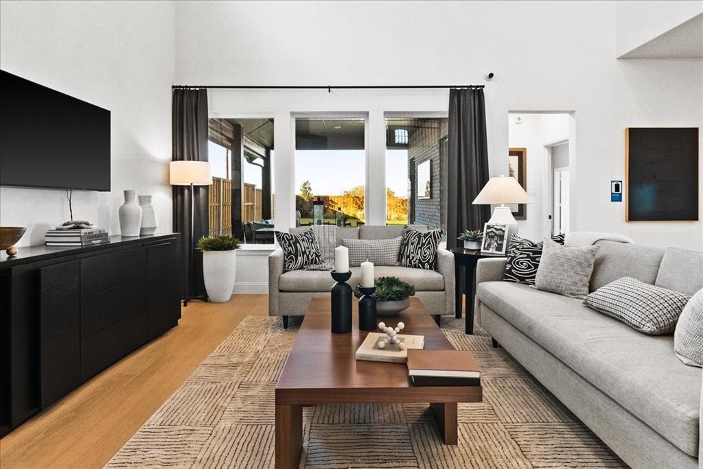 14550 Helena Street Pilot Point, TX 76258 - Photo 4 of 14 a living room with furniture and a flat screen tv