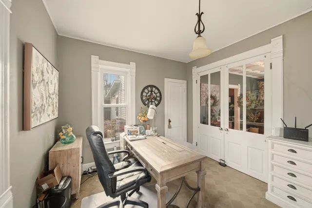 a view of a dining room with furniture and window