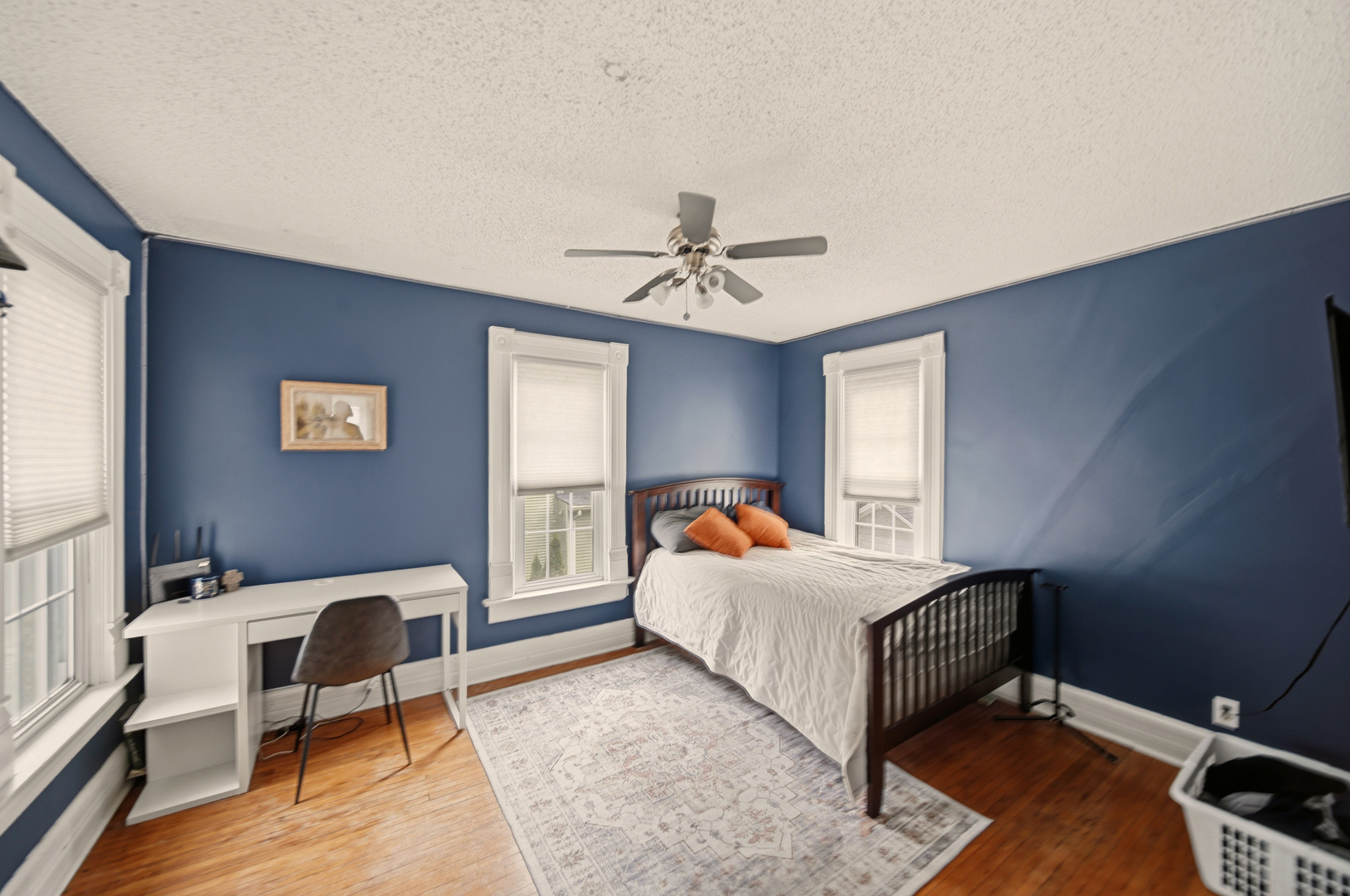 316 East 3rd Street Dixon, IL 61021 - Photo 24 of 45 a bedroom with a bed and a chandelier