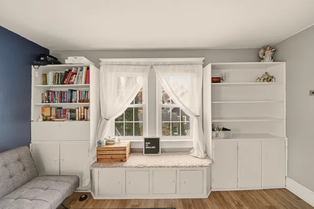 a view of living room with furniture and window