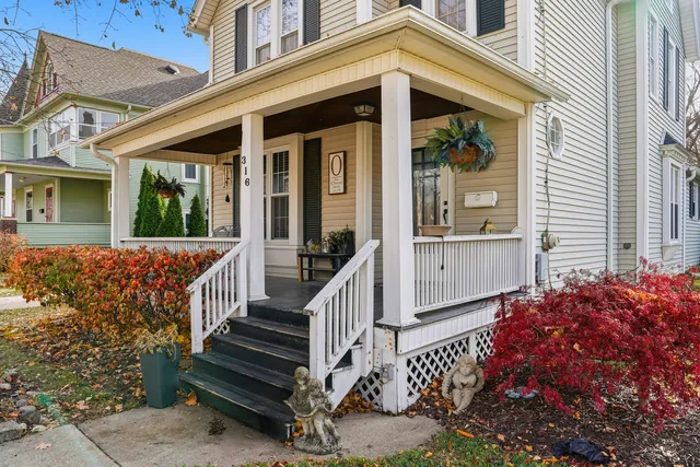 front view of a house with a large window