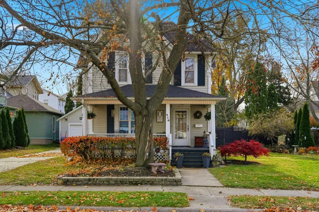 a front view of a house with garden
