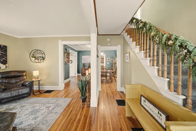 a view of a livingroom with furniture stairs