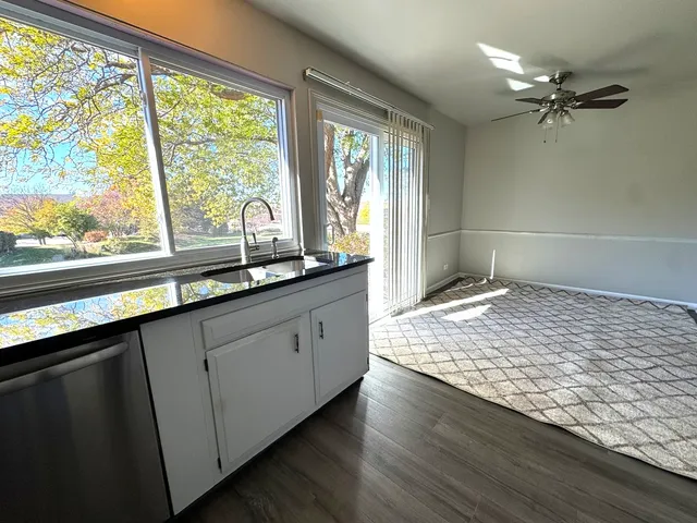 a bathroom with a sink and large window