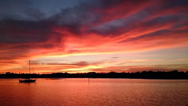 a view of swimming pool with outdoor seating