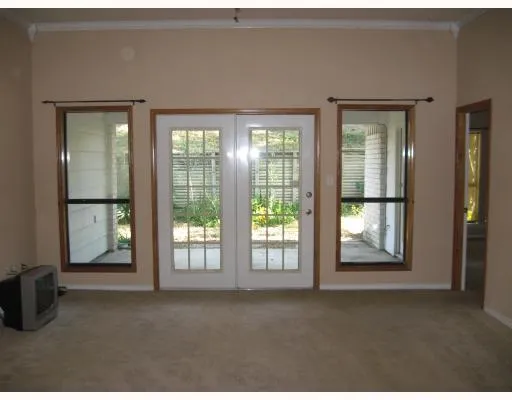 a view of empty room with floor to ceiling window