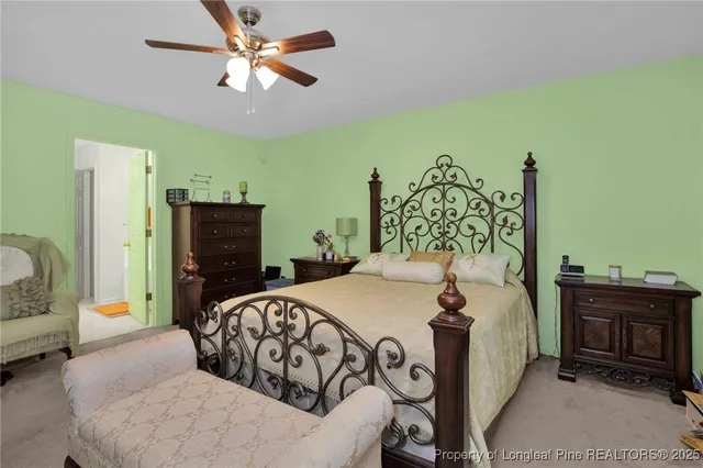 a bedroom with a bed dresser and a window