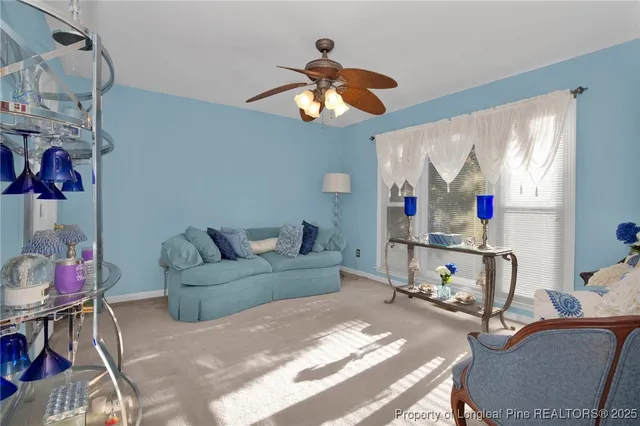 a living room with furniture a rug and decor