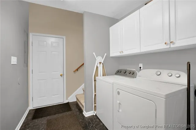 a view of storage and utility room with washer and dryer