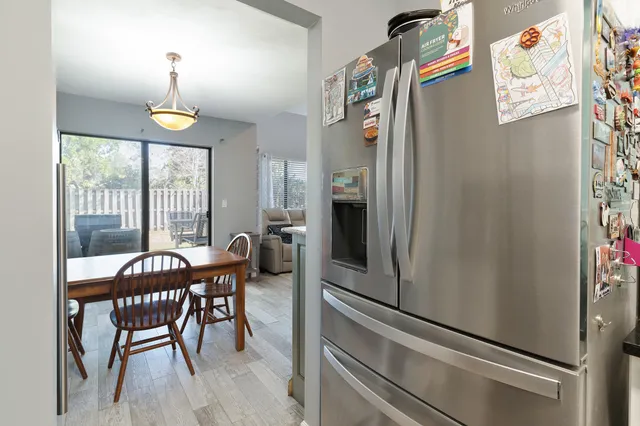 a kitchen with a sink cabinets and stainless steel appliances