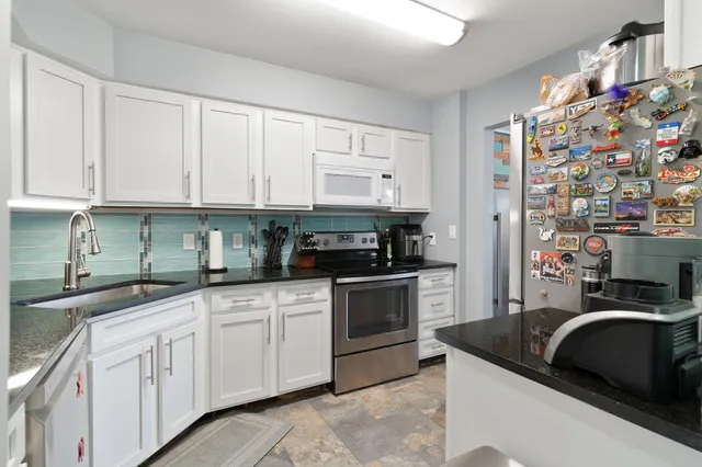 a view of a kitchen cabinets and a wooden floor