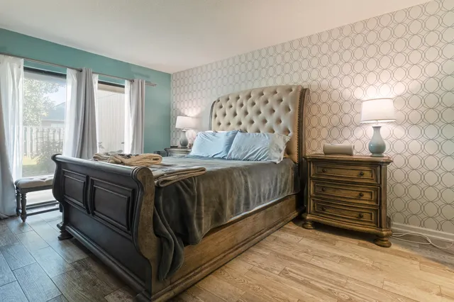 a bedroom with a bed and a dresser