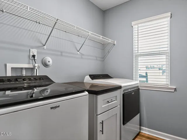 a kitchen with a stove and a window