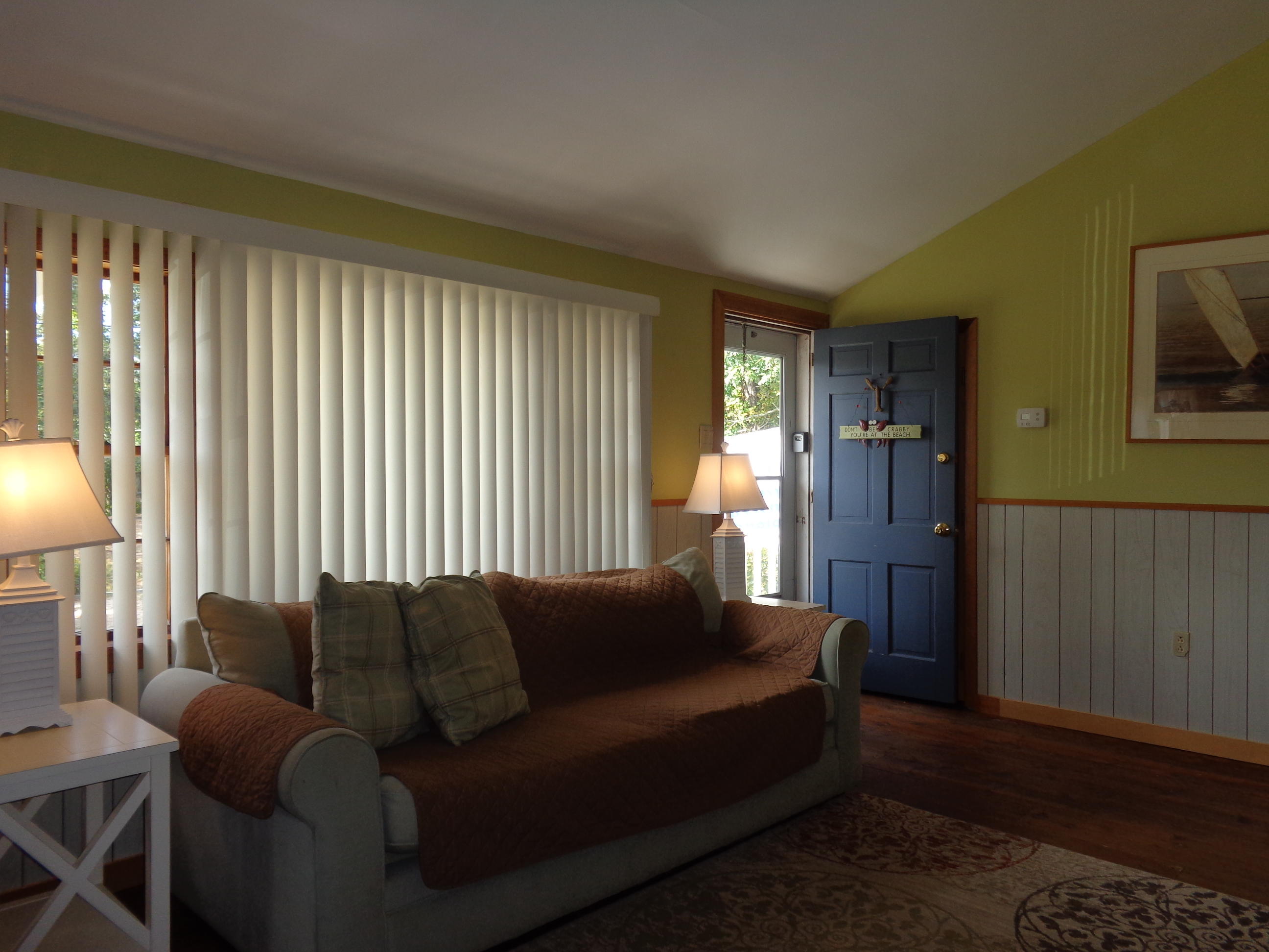 6 Huckleberry Lane Dennis Port, MA 02639 - Photo 11 of 23 a living room with furniture and a lamp