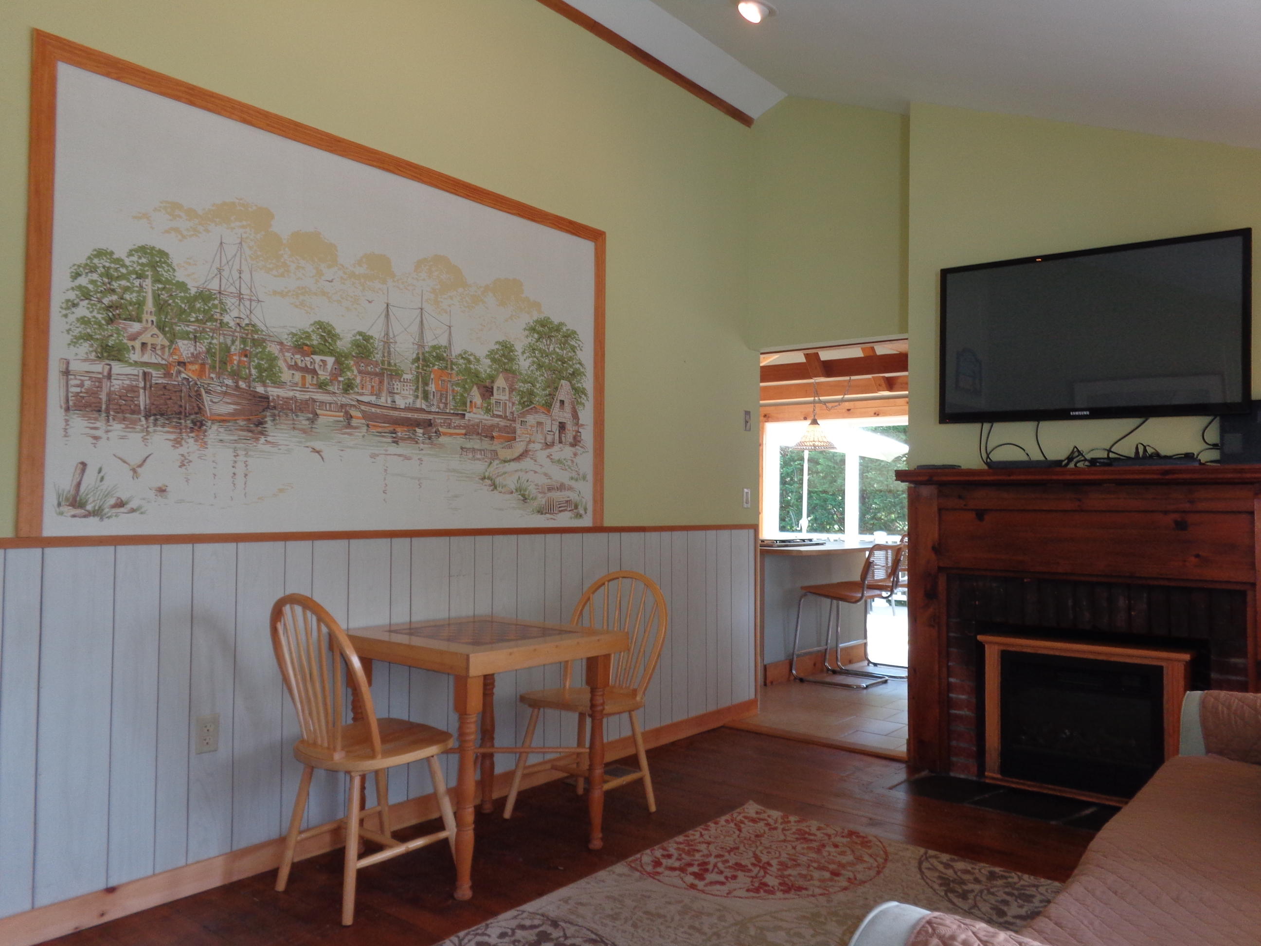 6 Huckleberry Lane Dennis Port, MA 02639 - Photo 13 of 23 a living room with furniture a flat screen tv and a fireplace