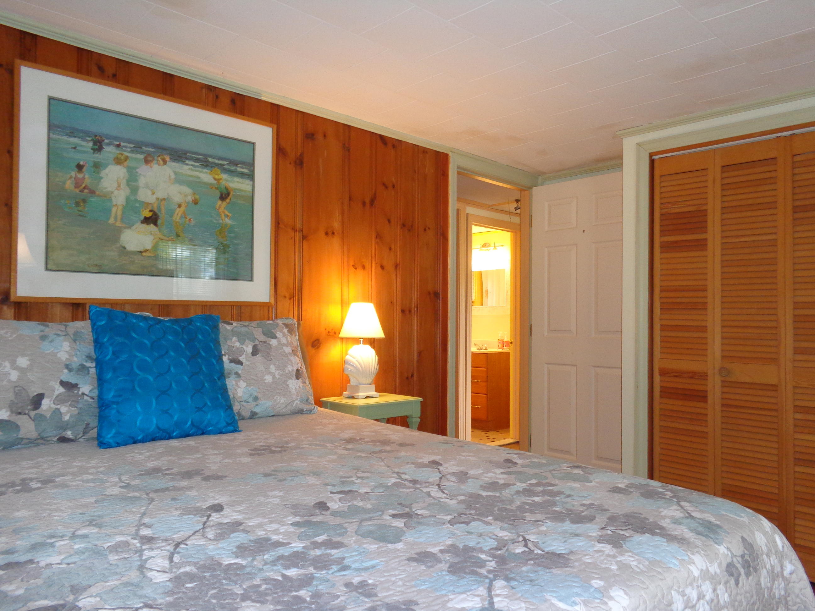 6 Huckleberry Lane Dennis Port, MA 02639 - Photo 14 of 23 a bedroom with a bed and a painting on the wall