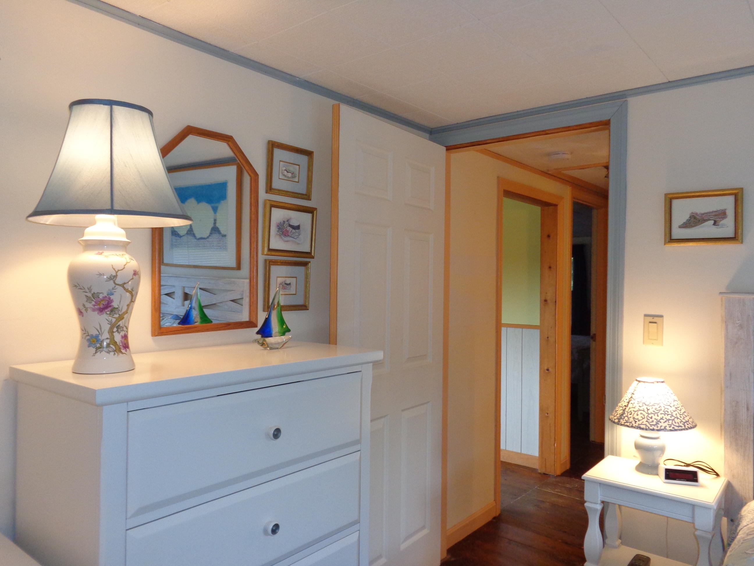 6 Huckleberry Lane Dennis Port, MA 02639 - Photo 18 of 23 a view of bedroom with a large bed and lamp on dresser