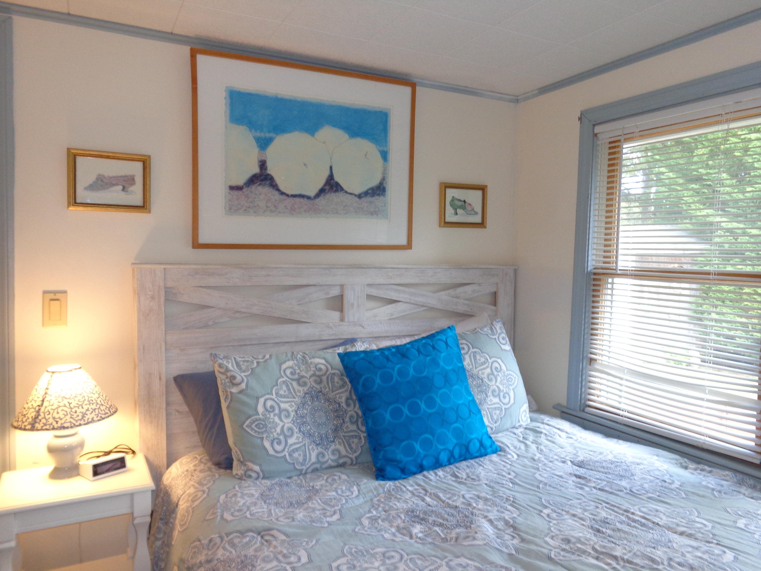 6 Huckleberry Lane Dennis Port, MA 02639 - Photo 19 of 23 a room with a bed and painting on the wall