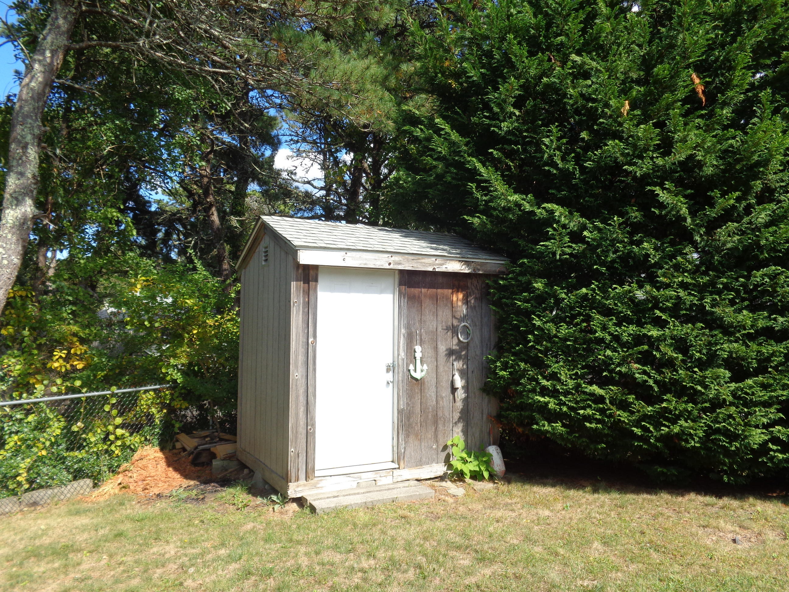 6 Huckleberry Lane Dennis Port, MA 02639 - Photo 21 of 23 a view of entryway with flower plants