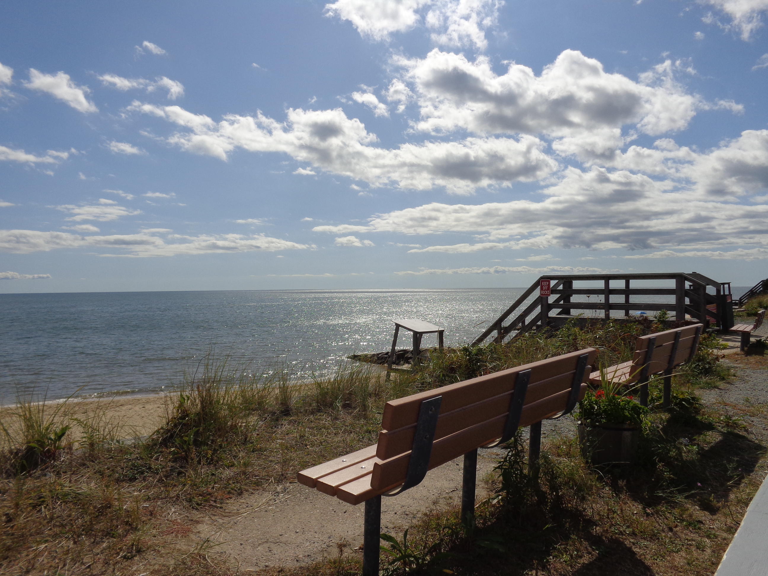 6 Huckleberry Lane Dennis Port, MA 02639 - Photo 22 of 23 a view of a terrace with a bench