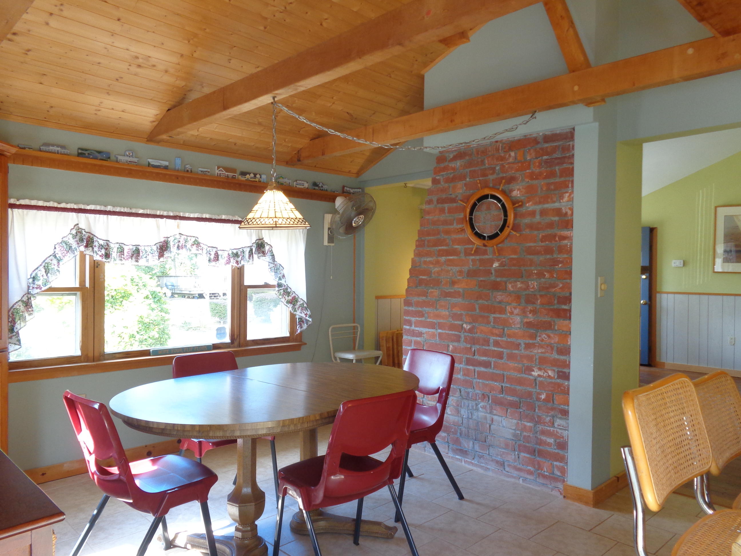 6 Huckleberry Lane Dennis Port, MA 02639 - Photo 6 of 23 a view of a dining room with furniture and window