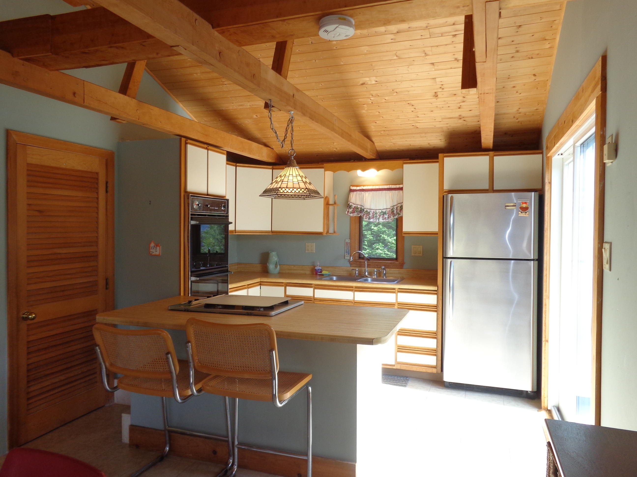 6 Huckleberry Lane Dennis Port, MA 02639 - Photo 9 of 23 a kitchen with stainless steel appliances granite countertop a sink and a refrigerator