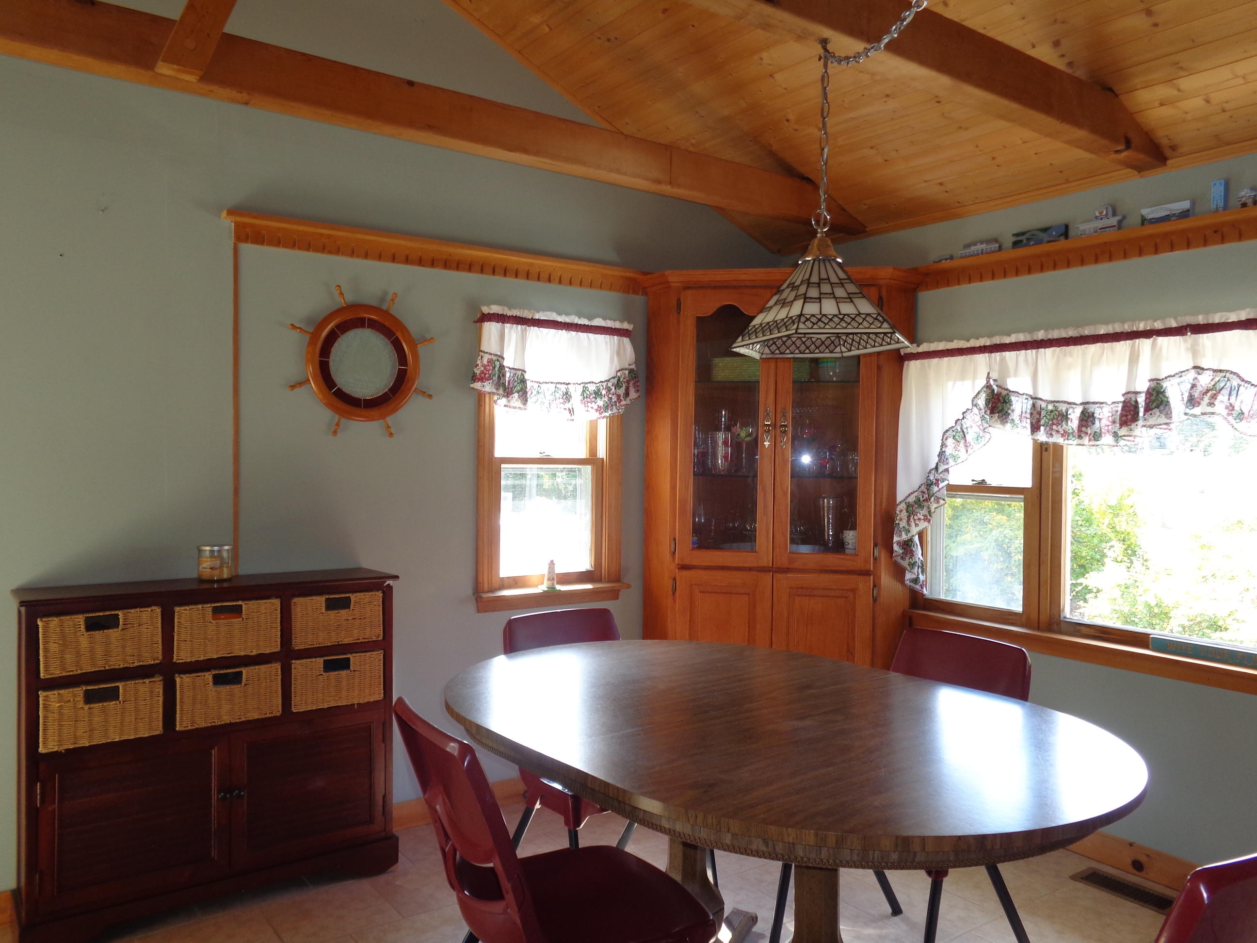 6 Huckleberry Lane Dennis Port, MA 02639 - Photo 10 of 23 a view of a dining room with furniture window and wooden floor