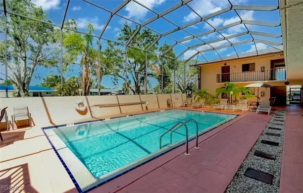a view of a backyard with chairs
