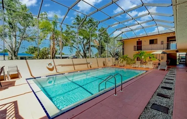 a view of a backyard with chairs